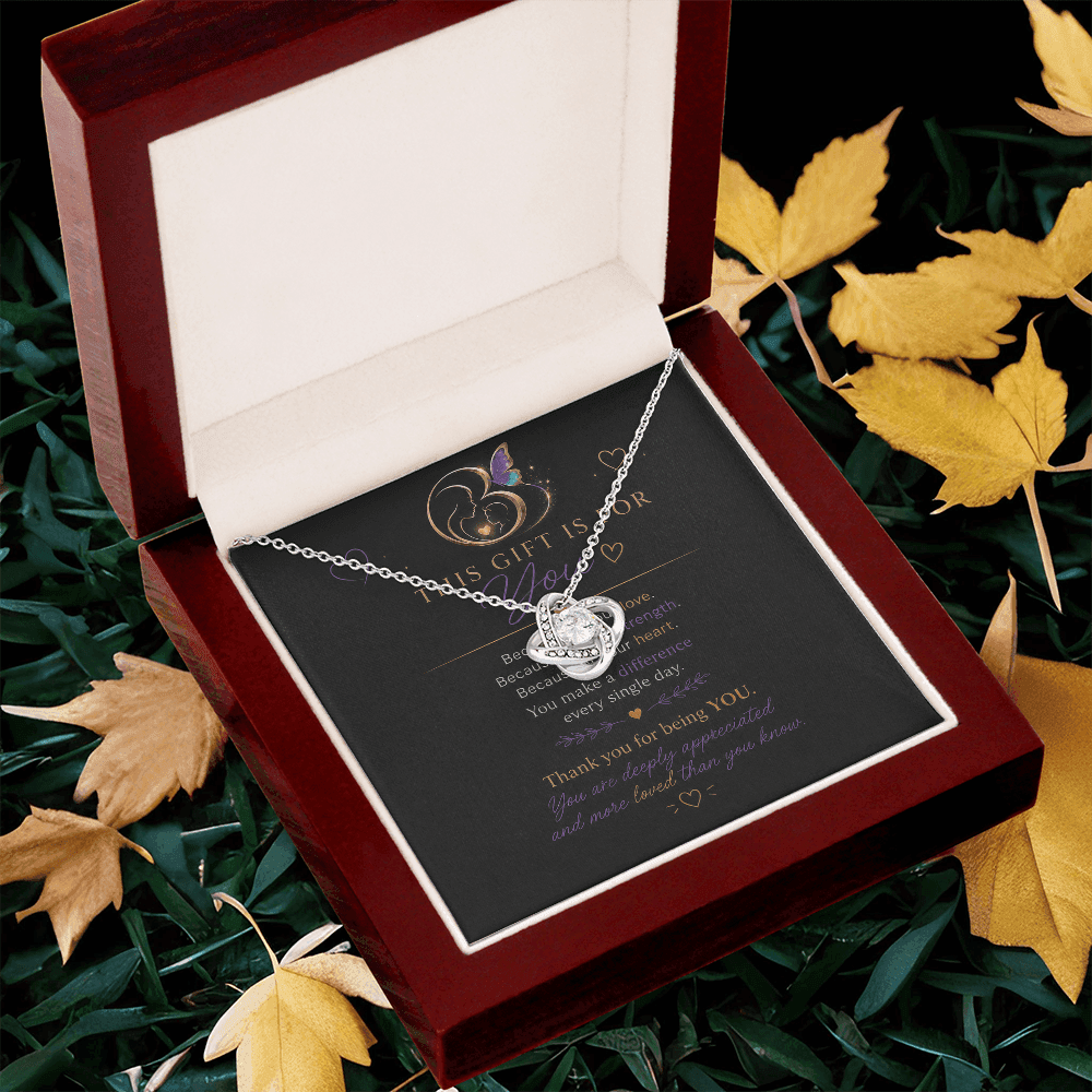 14K white gold Eternal Hope Necklace displayed in an open luxury gift box on a wooden surface